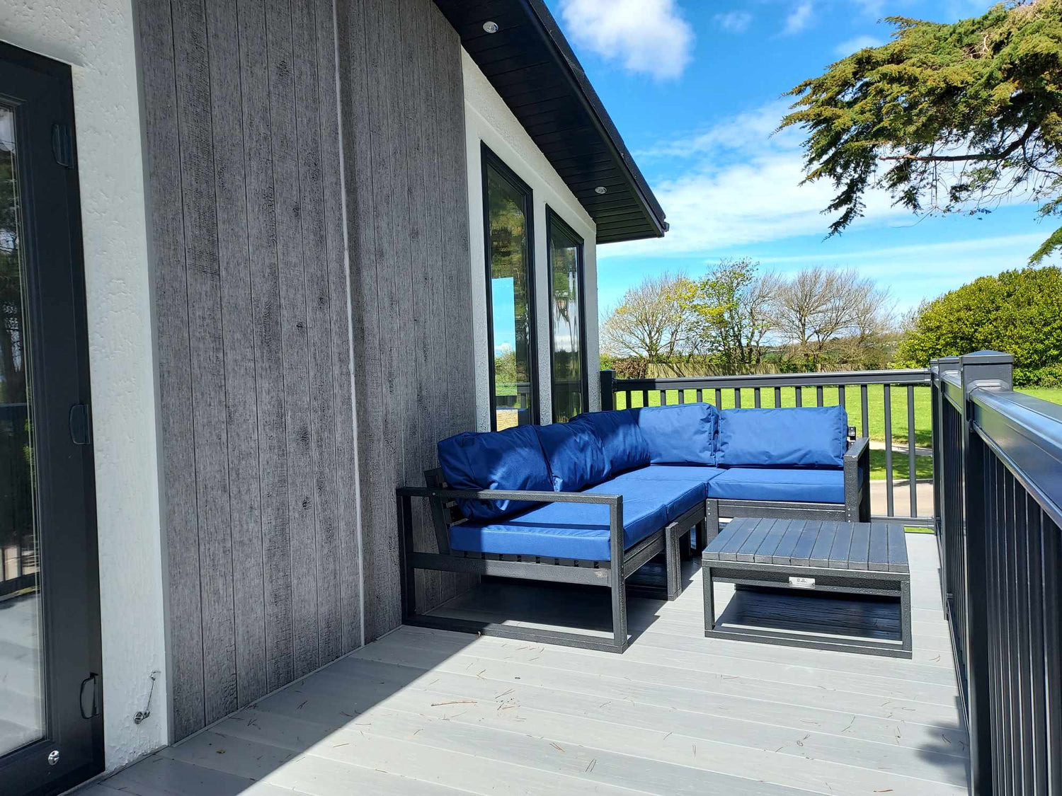 L-Shape Garden Sofa with Royal Blue waterproof cushions